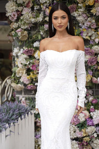 Close Up Image of White Off-the-shoulder Long Sleeve Fitted Wedding Gown
