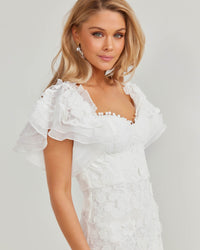 Close Up Image of Frilled Puff Sleeves of Side Image showcasing Slimming Fit of Twosisters The Label White Floral Lace Mini Dress featuring Off The Shoulder Sweetheart Neckline and Frilled Hem Sleeves and Skirt