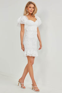 Side Image showcasing Slimming Fit of Twosisters The Label White Floral Lace Mini Dress featuring Off The Shoulder Sweetheart Neckline and Frilled Hem Sleeves and Skirt