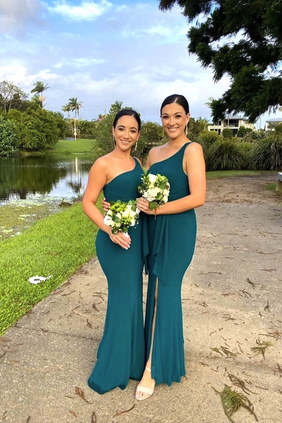 Deep Green Bridesmaids One Shoulder Maxi-Length Dress with Asymmetrical Neckline, Waist Tie, Above Knee High Slit, and a Column Styled Silhouette