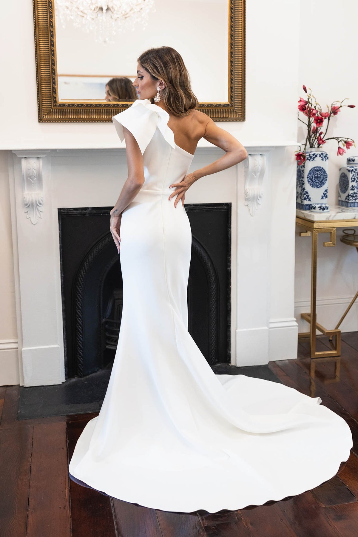 Sweep Train Design of Ivory White One Shoulder Fit & Flare Wedding Gown with Ruffle Detail