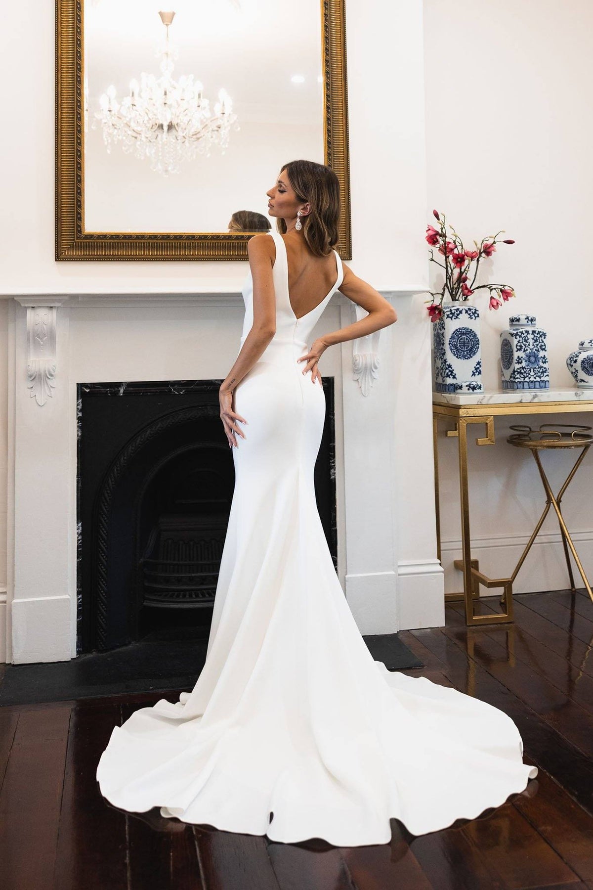 Back Image of Ivory White V-Neck Crepe Wedding Dress in Mermaid Silhouette, Deep V Neckline, Open V-Shape Back, Medium Long Train