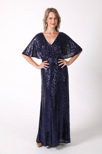 Mature woman sequin maxi dress with V neckline, butterfly sleeves in navy