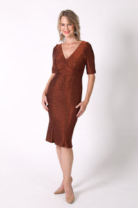Mature woman midi dress with V neckline, elbow length sleeves and fitted silhouette in shimmer copper color