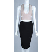 Front of beige V plunging neckline bandage crop top with side cutouts and crisscross band design at the back paired with black midi pencil skirt