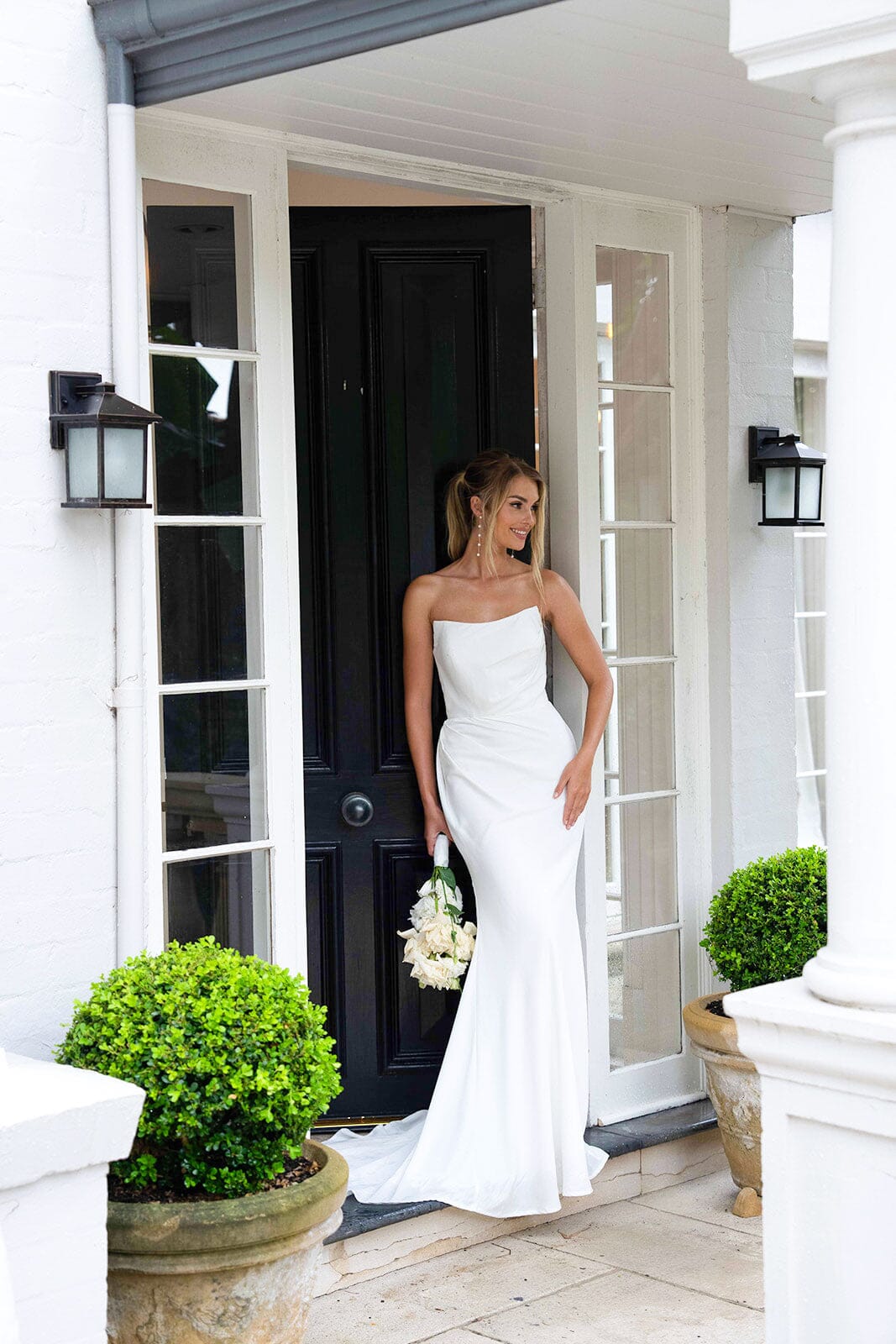 Fitted Silhouette of White Satin Bridal Gown with Strapless Scoop Neckline and Gathered Detail
