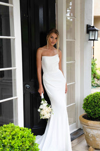 White Satin Bridal Gown with Strapless Scoop Neckline and Gathered Detail styled with white rose bouquet