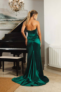 Half Open Back Design of Emerald Green Strapless Fitted Evening Gown with Corset Style Bodice, Thigh High Side Slit and Sweep Train