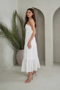 Side Image of White Summer Maxi Cotton Dress with V Neck Cutout Detail, Halter Neck Strings and Flowy Tiered Maxi Skirt