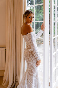 Off-Shoulder Long Sleeve Design of Nude Illusion Fitted Wedding Dress in White Pattern Sequin and Nude Underlay