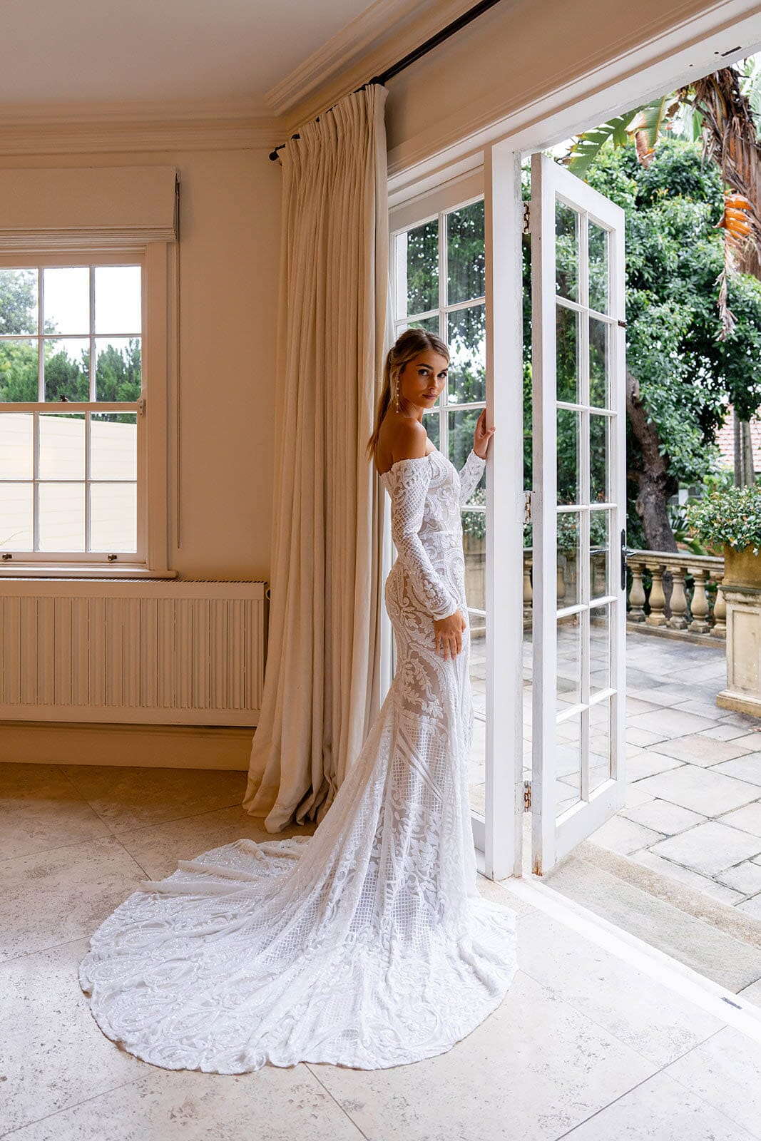 Moderate Sweep Train of Nude Illusion Fitted Wedding Dress with Off-Shoulder Long Sleeves in White Pattern Sequin and Nude Underlay