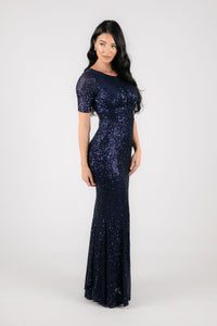 Side Image of Form Fitting Modest Navy Deep Blue Sequin Evening Maxi Dress with Round Neckline, Fitted Short Sleeves and Side Slit