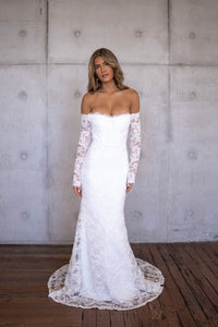 Ivory White Off The Shoulder Long Sleeve Lace Wedding Gown with Sweetheart Neckline, Corset Bodice and Fit and Flare Mermaid Silhouette