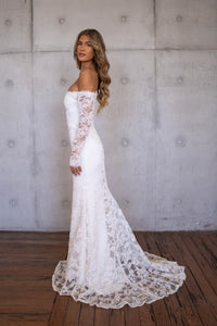 Side Image of Ivory White Off The Shoulder Long Sleeve Lace Wedding Gown with Sweetheart Neckline, Corset Bodice and Fit and Flare Mermaid Silhouette