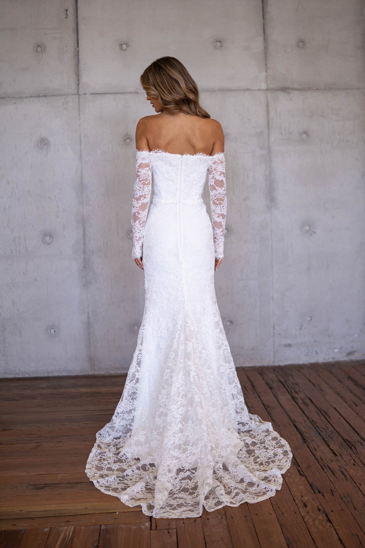 Back Image of Bare Shoulder Design, Concealed Back Zipper and Sweep Train of Ivory White Off The Shoulder Long Sleeve Lace Wedding Gown with Sweetheart Neckline, Corset Bodice and Fit and Flare Mermaid Silhouette