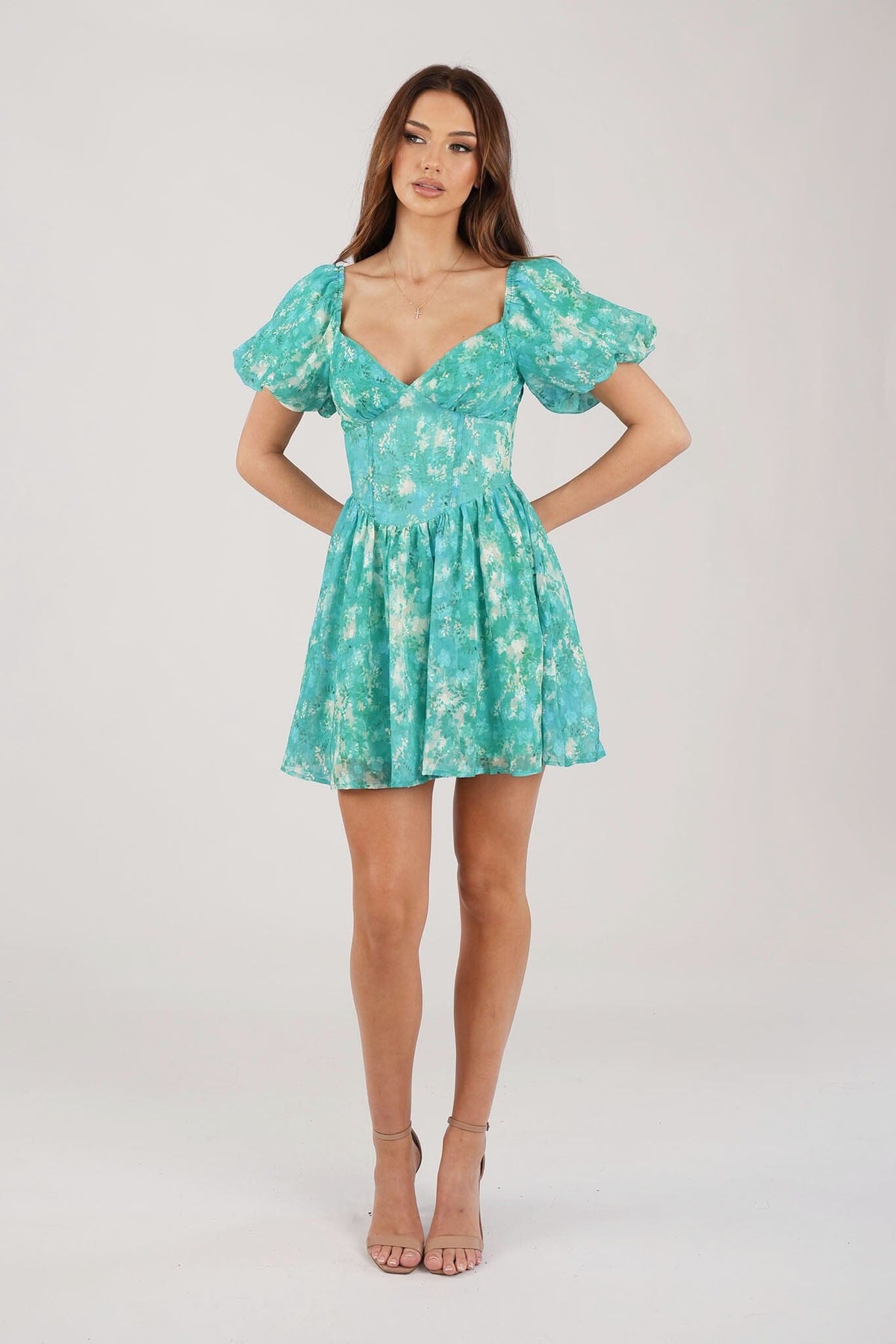 Green Floral Mini Dress with Sweetheart Neckline and Puff Sleeves worn on shoulder