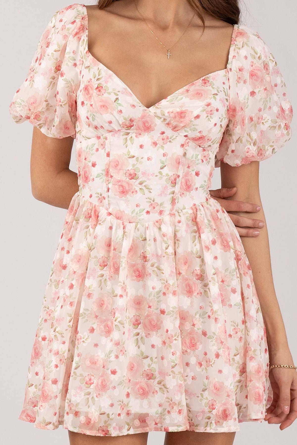 Close Up Image of Pink Floral Mini Dress with Sweetheart Neckline and Puff Sleeves