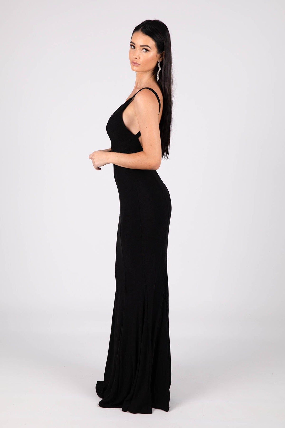 Side Image of Shimmer Black Fitted Evening Gown with V Neckline and Backless Design