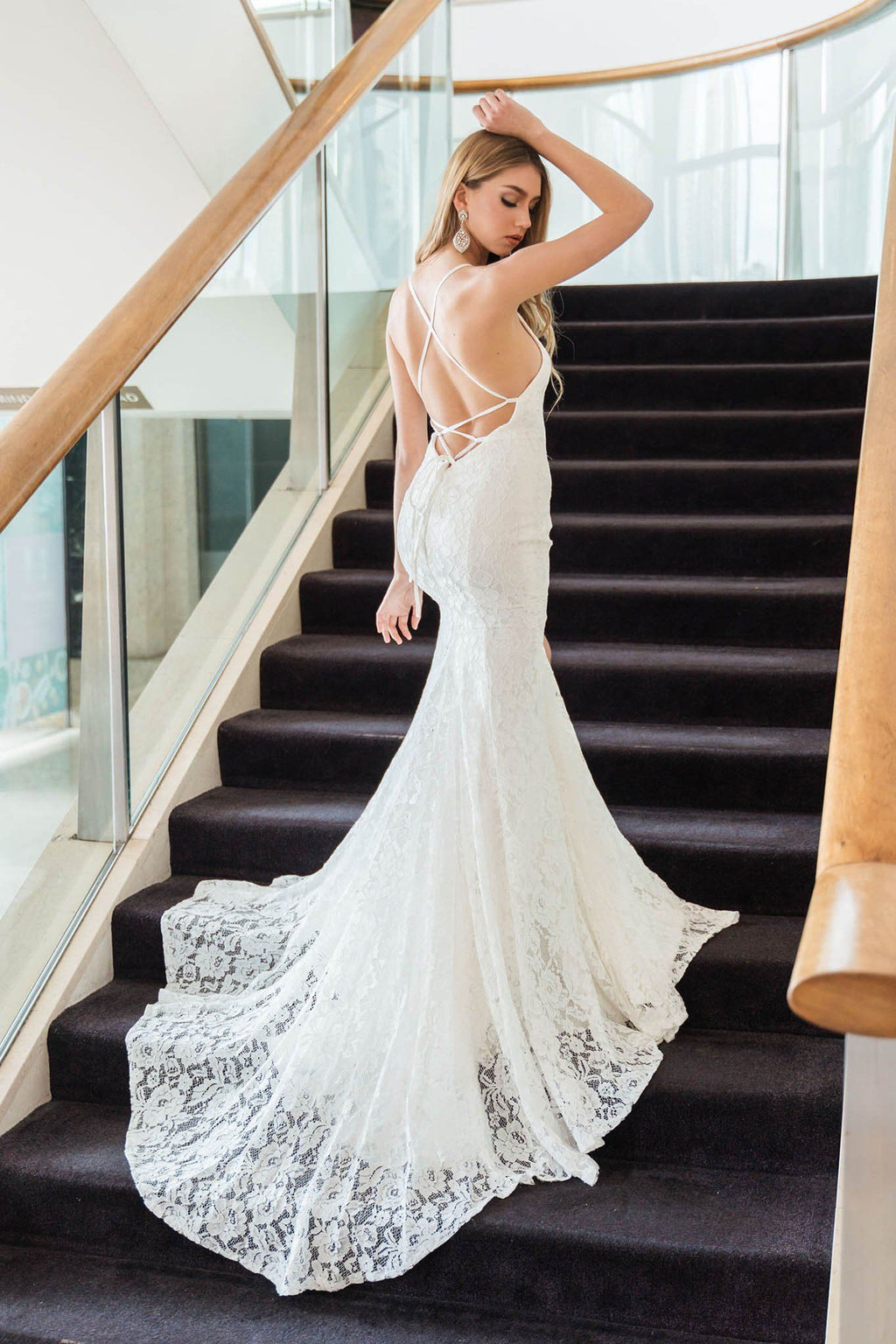Ivory white lace fit and flare long wedding gown with side slit, lace up open back, and sweep train