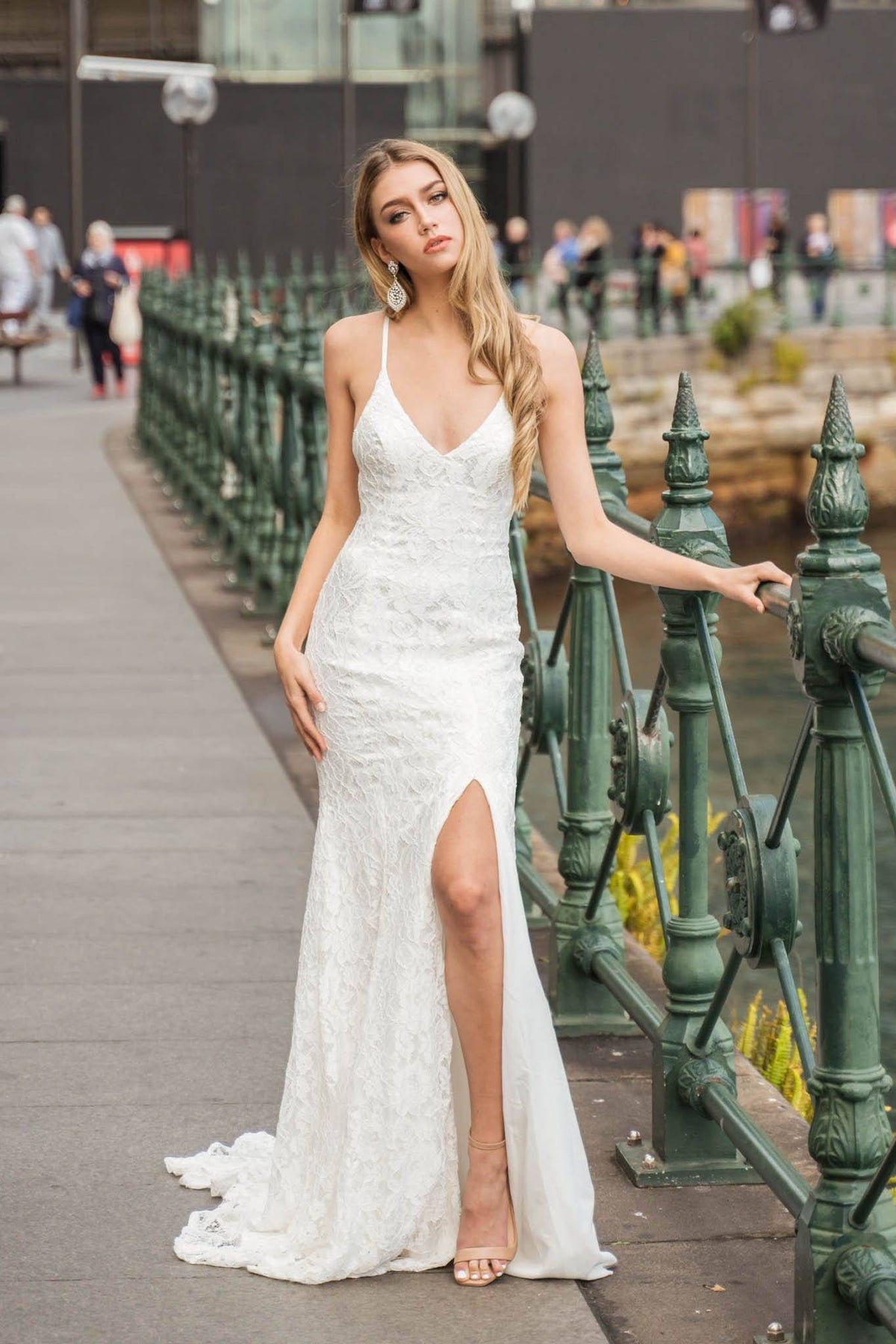 White lace mermaid long evening gown with leg split, lace up back, and long train 