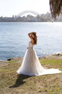 Side Image of Ivory Off White Lace A-line Wedding Gown with Floral and Vine-like Lace Motifs Embellished on Layered Tulle