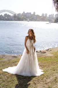 Ivory Off White Lace A-line Wedding Gown with Floral and Vine-like Lace Motifs Embellished on Layered Tulle, Trendy Exposed Bone Bodice, Voluminous Full A-line Skirt and Flowing Sweep Train