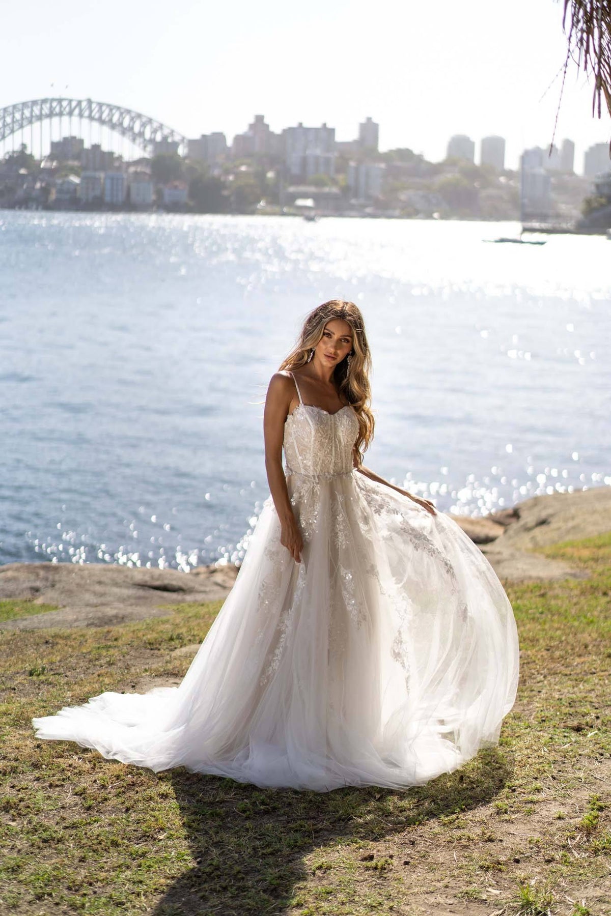 Ivory Off White Lace A-line Wedding Gown with Floral and Vine-like Lace Motifs Embellished on Layered Tulle, Trendy Exposed Bone Bodice, Voluminous Full A-line Skirt and Flowing Sweep Train