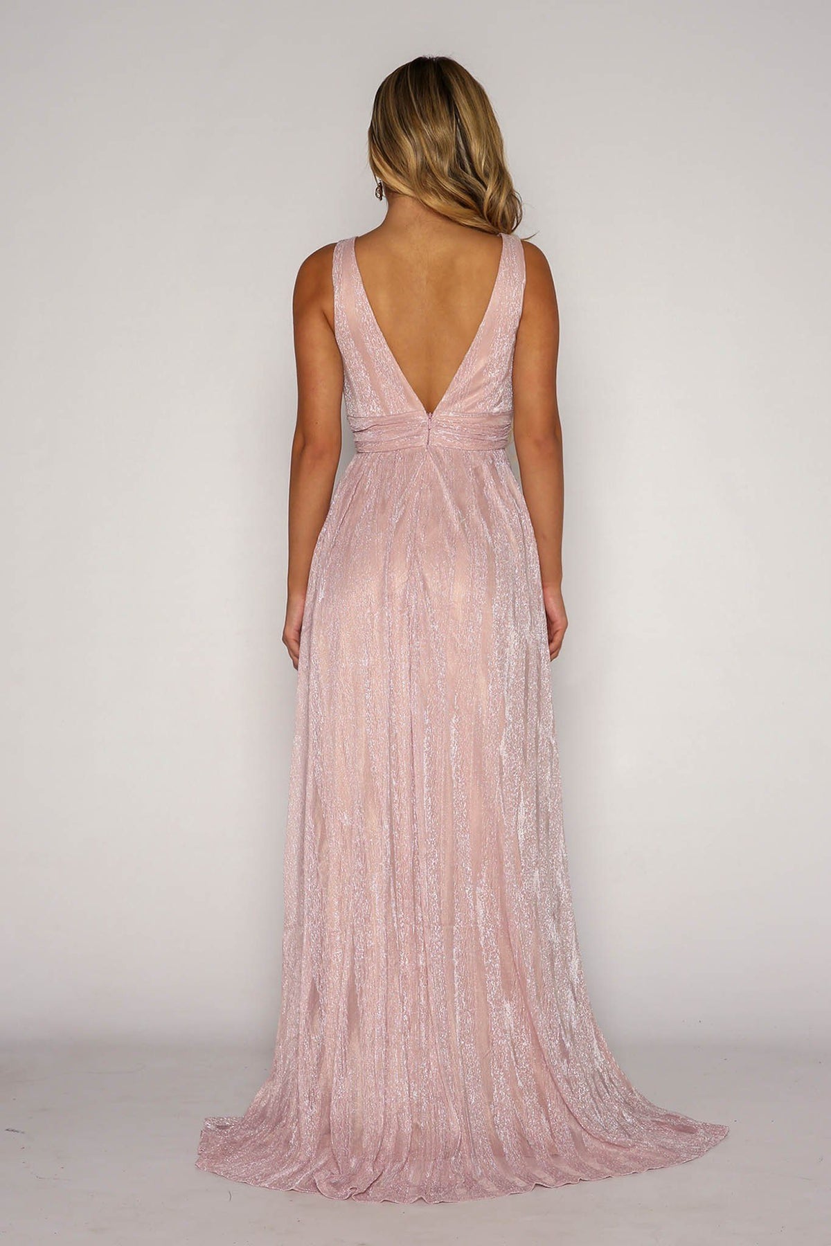 Open Back Design of Shimmer Pink Grecian Style Full Length A-Line Gown featuring Gathered Waistline, Draping Throughout the Skirt and V Neckline with Mesh Insert