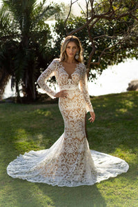 Long Sleeve Wedding Gown featuring White Vintage Inspired Lace Pattern with Chai Coloured Underlay in Sheer Illusion Design, Long Sleeves with Scalloped Edge, Fit and Flare Silhouette, Illusion V Plunging Neckline, Low Back and Sweep Train