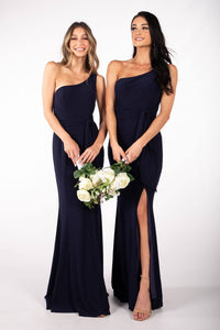Navy Bridesmaids One Shoulder Maxi-Length Dress with Asymmetrical Neckline, Waist Tie, Above Knee High Slit, and a Column Styled Silhouette