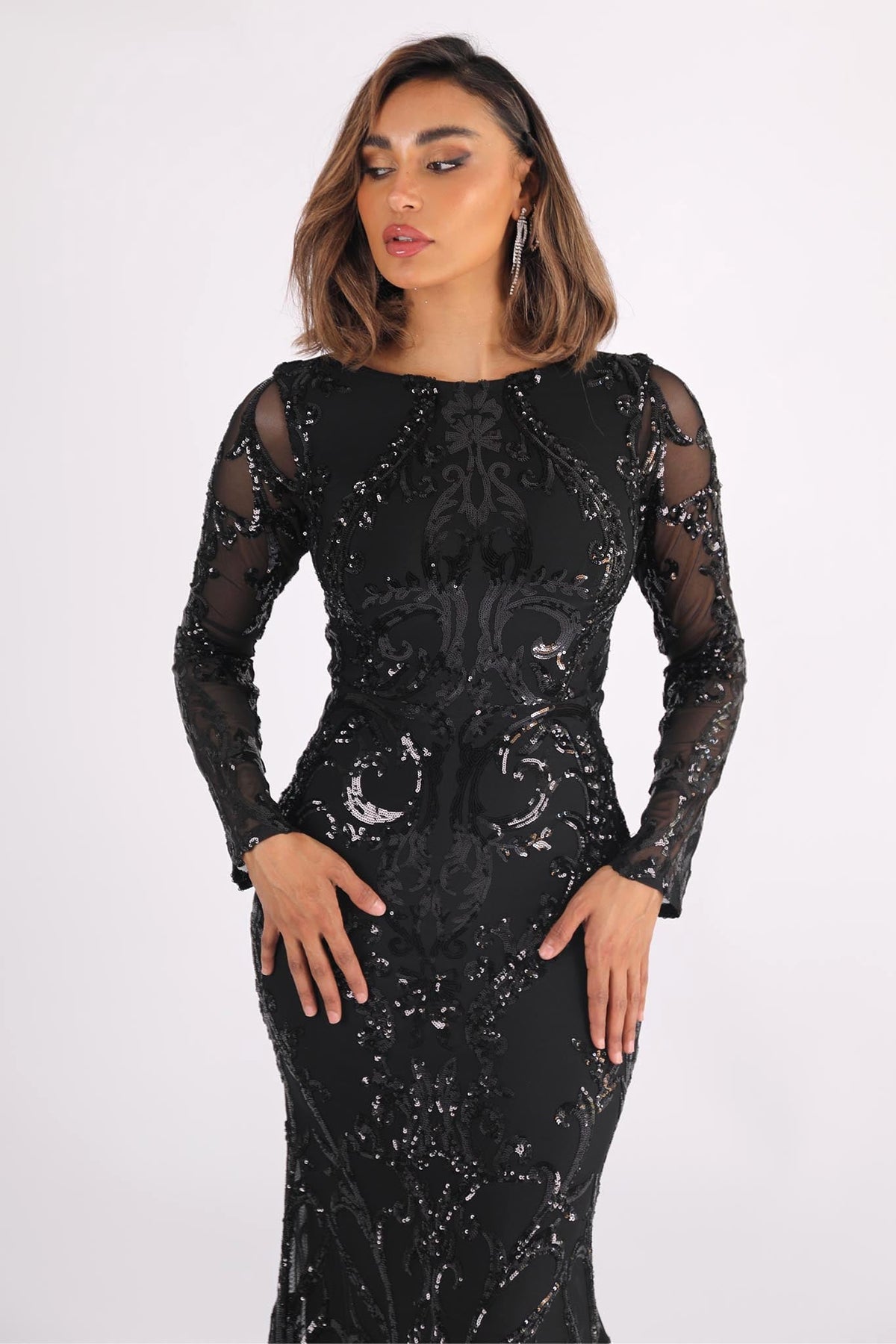 Close Up Image of Black Long Sleeve Pattern Sequin Floor Length Evening Gown with Round Neck and Fit & Flare Silhouette