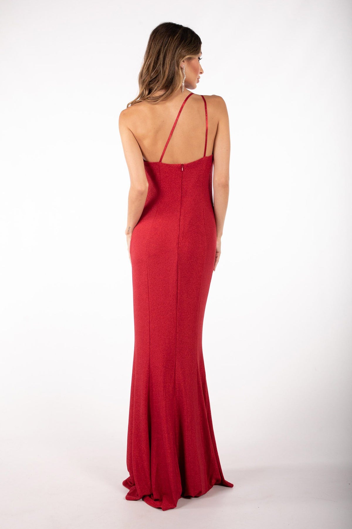 Back image of Shimmer red maxi dress featuring asymmetrical one shoulder neckline, a bodycon fit with gathering detail at the front and thigh-high leg slit