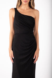 Close up image of Shimmer Black maxi dress featuring asymmetrical one shoulder neckline, a bodycon fit with gathering detail at the front and thigh-high leg slit
