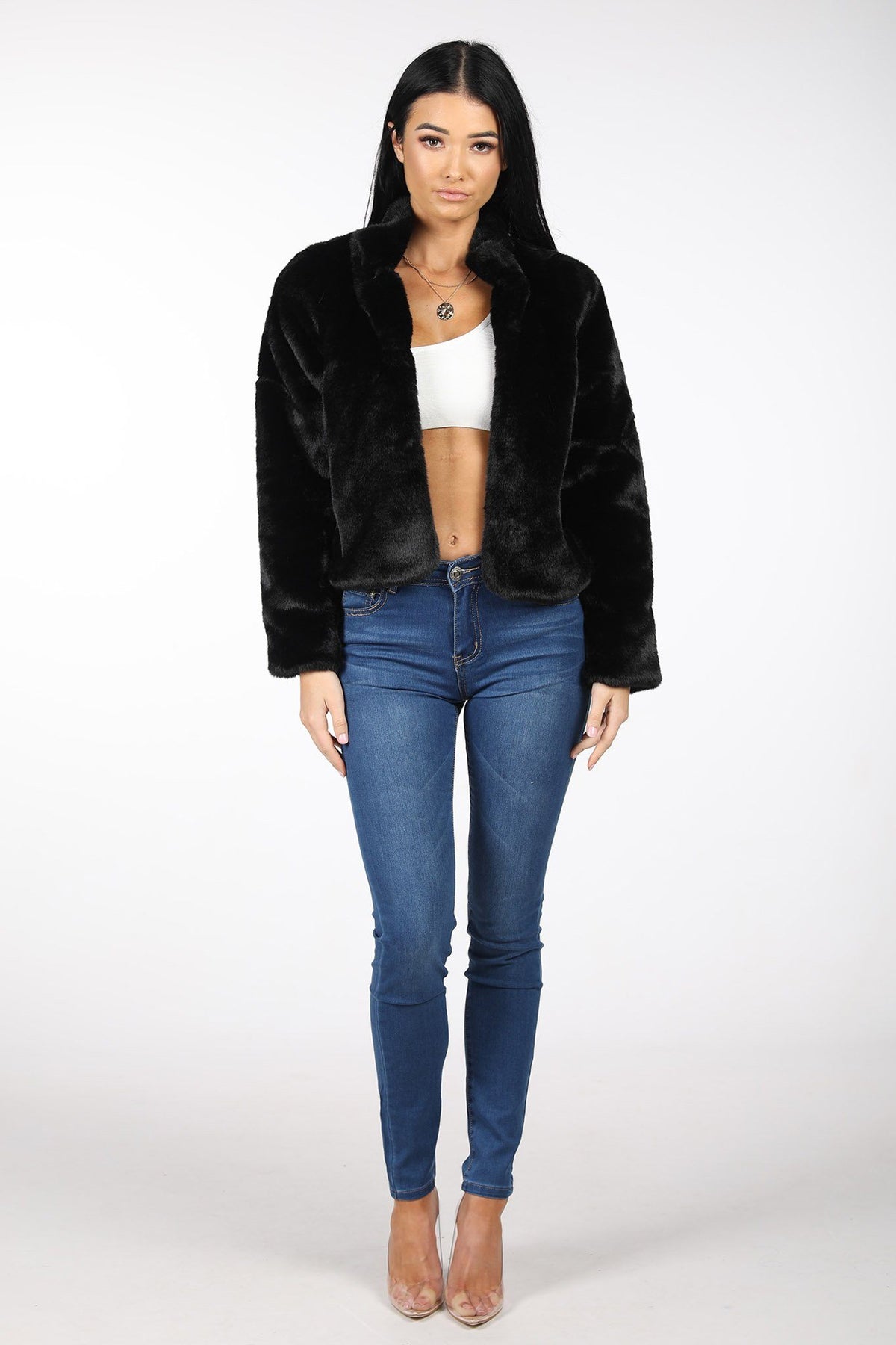 Black Cropped Faux Fur Coat Styled with White Cropped Top and Denim Skinny Jeans