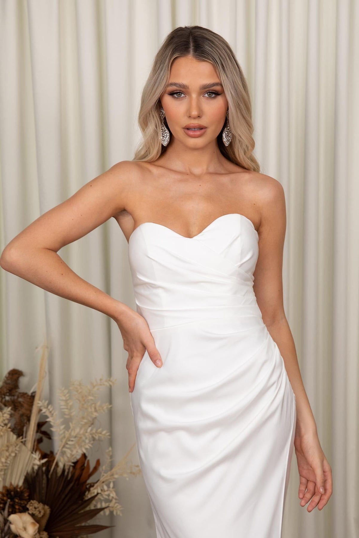 Close Up Image of Ivory White Fit and Flare Wedding Gown with Sweetheart Strapless Bodice and Gathered Draping Detail