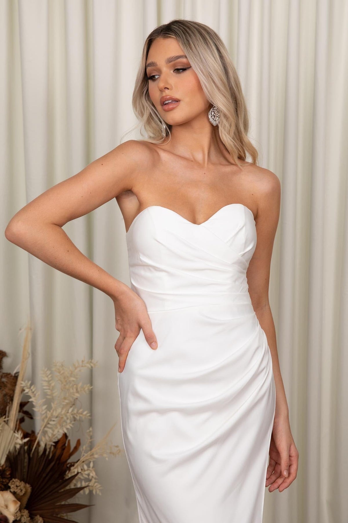 Close Up Image of Ivory White Fit and Flare Wedding Gown with Sweetheart Strapless Bodice and Gathered Draping Detail