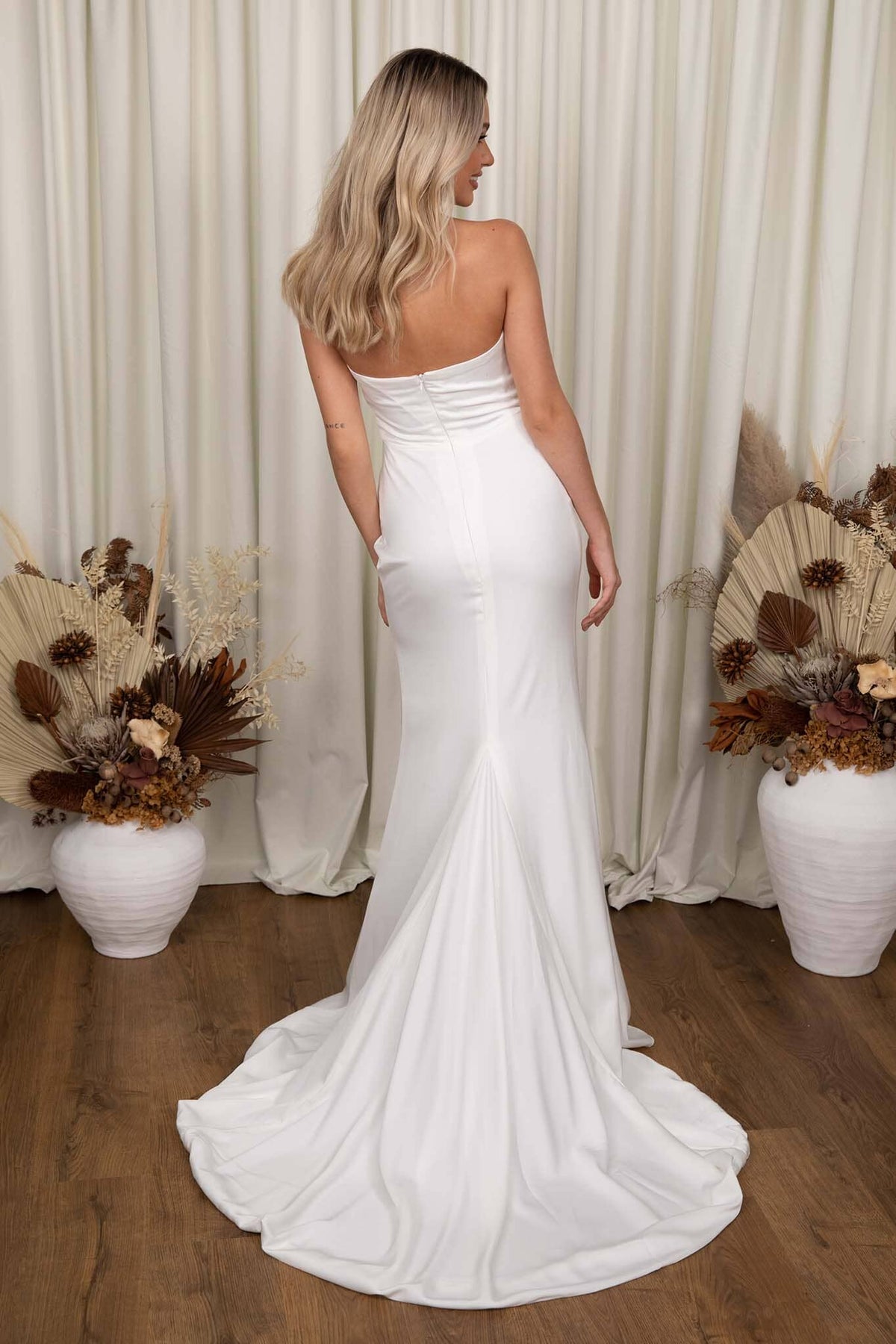 Back Image of Ivory White Fit and Flare Wedding Gown with Sweetheart Strapless Bodice and Gathered Draping Detail