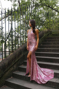 Bright pink sequin sleeveless evening long gown with deep V neckline, thigh-high slit, halter-neck strings, open back, and long train