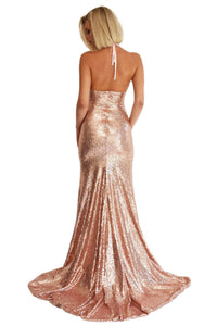 Back shot of rose gold sequin evening formal prom gown with high front leg slit, deep v neckline, and long train