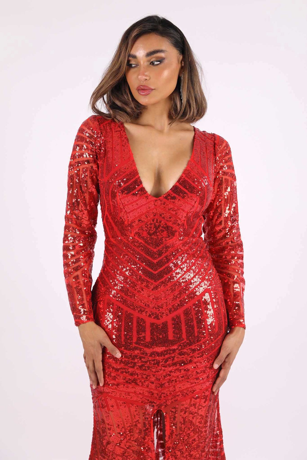 Close up image of red long sleeve geometric pattern sequin full length evening gown with V plunge neckline, center front slit and floor sweeping train