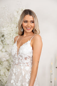 Close Up Image of Ivory White Romantic Tull A-line Wedding Dress with Hand-Sewn Floral Lace Motifs, Pearl Beaded Spaghetti Straps, V Neck, Full Airy A-line Skirt and Chapel Train