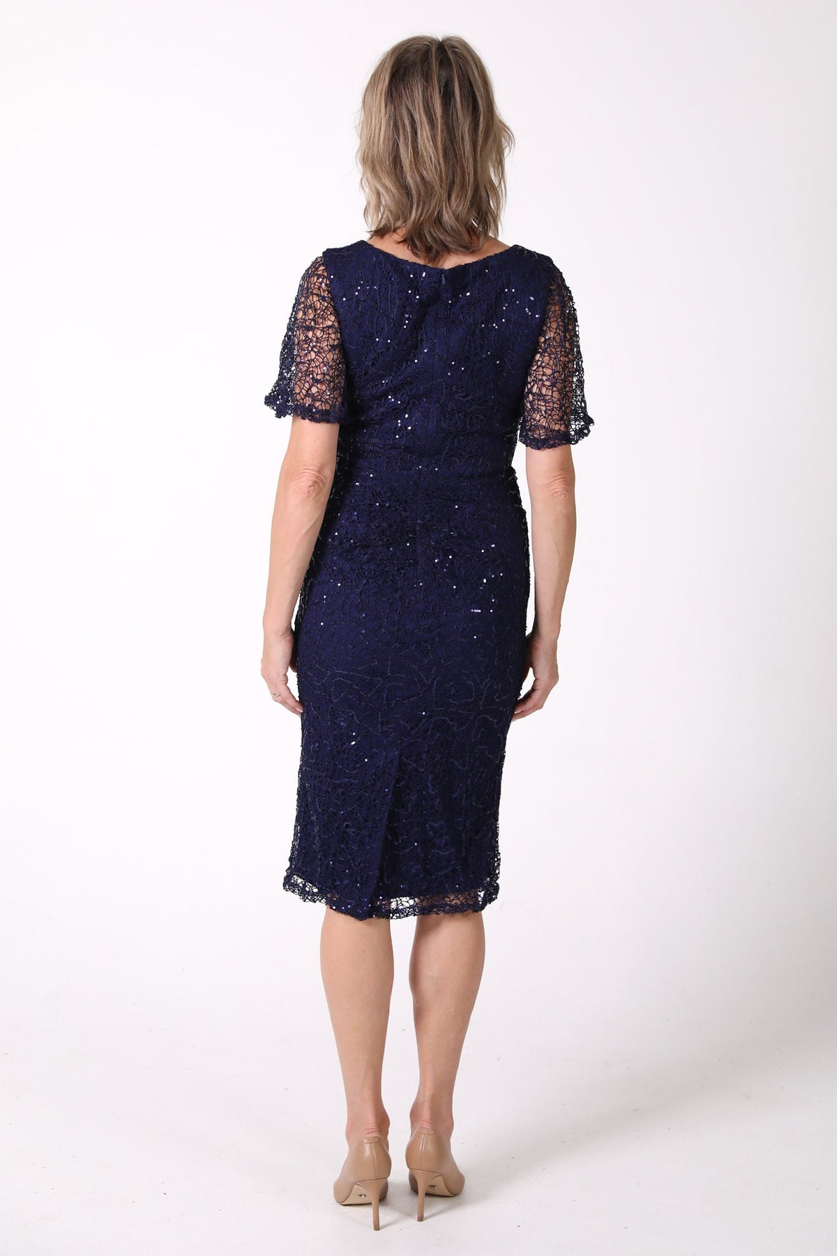 Back image of Mature woman sequin cocktail dress with V neckline and butterfly sleeves in navy color