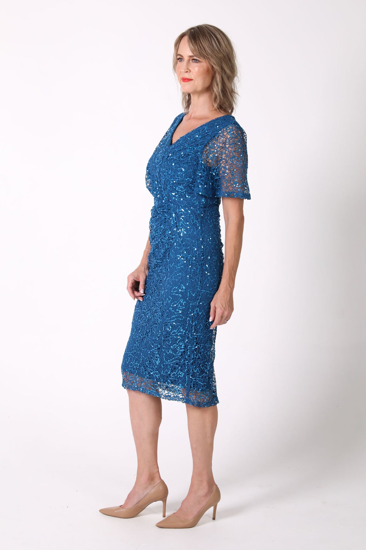 Mature woman sequin cocktail dress with V neckline and butterfly sleeves in teal color