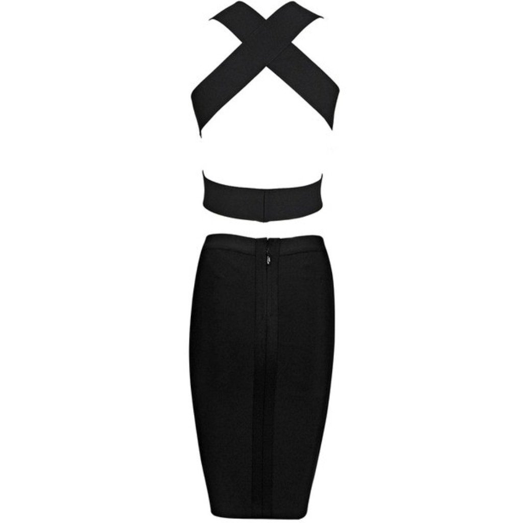 Back of beige V plunging neckline bandage crop top with side cutouts and crisscross band design at the back paired with black midi pencil bandage skirt
