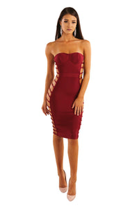 Maroon wine red strapless knee length bandage dress subtle sweetheart neckline side cutouts with faux gold buttons