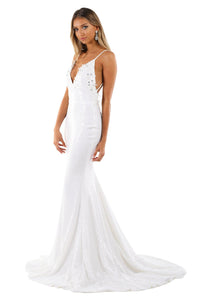 White Sequin Sleeveless Evening Gown features hand beaded lace detailing, plunging neckline, thin shoulder straps, V backless design, fitted bodice to the knees then the skirt flares out in a mermaid style with a long train