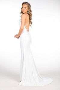 White full length sequin gown featuring hand beaded lace detail, V plunging neckline, thin straps with lace up on open back and sweep train