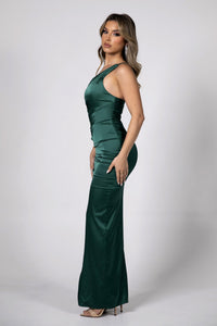 Side Image showing Column Silhouette of Form Fitting Satin Maxi Dress with One Shoulder Neckline, Gathering Detail at Waist and Frill Hemline in Deep Green Color